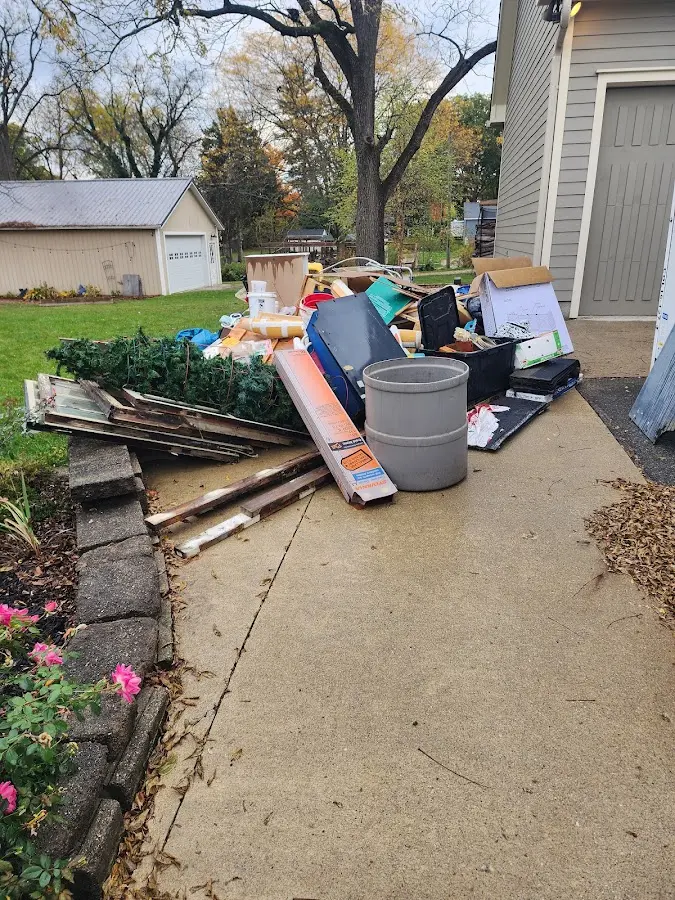 Dumpster being loaded with debris for 3 Yard Dumpster Rental in New Albany